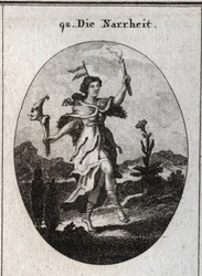 Alegoria da loucura. a pele do urso deseja a loucura que carrega a raiva, a ação da dança enfatiza aqueles que se vestem para esperar. O palheta em sua cabeça marca a instabilidade das fantasias. Ela contrasta a luz de uma vela com os raios de luz do su