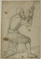 Homem no joelho dobrado, puxando a corda