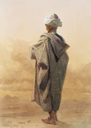Cairo, um árabe ao anoitecer antes das Pirâmides