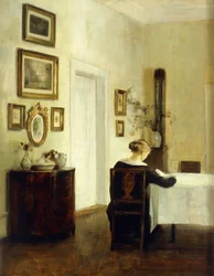 Uma mulher em uma mesa em um interior
