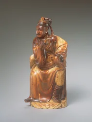 Uma figura de Guandi sentado, do século 14 ao 15 (esculpida em marfim)