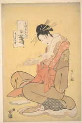 A oiran Komurasaki de Kadotamaya a ler uma carta