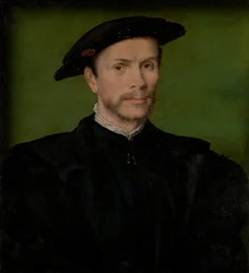 Retrato de um homem barbado de preto.