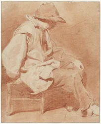 Homem sentado com um boné, a mão esquerda no joelho, virado para a direita