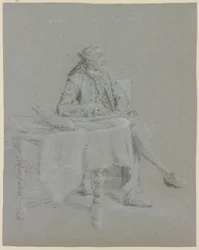 Cavalheiro sentado à mesa