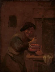Homem comendo de uma panela de barro