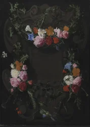 Uma cartela de pedra com uma guirlanda de flores