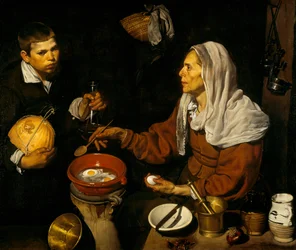 Uma mulher idosa a cozinhar ovos