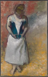 Mulher em pé de frente, apertando o espartilho, 1883