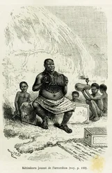 Ketimkuru, chefe tribal, a tocar acordeão. Gravura de Riou para ilustrar o relato «Os lagos da África Equatorial», de Victor Giraud, guarda-marinha, em 1883-1885, em Le Tour du monde, 1886, sob a direção de Édouard Charton (1807-1890), Hachette