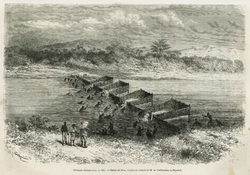 A indústria da pesca no rio Eboga, que aprisiona os peixes, conduz através das corredeiras pelas suas argilas de bambu, desenhadas por Riou, para ilustrar a história de uma viagem ao Gabão e ao rio Ogoue, em 1875-1877, por Alfred Marche. Gravura em Le tour