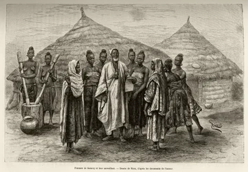 Mulheres de Samory Touré (c. 1835-1898), chefe de guerra da curva do Níger, e o seu supervisor, um Soninquê, que sabe ler e escrever árabe, como prova o papel que segura na mão. Gravura de Riou para ilustrar a narrativa 