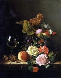 Um copo de vinho, uvas, nozes e rosas na borda