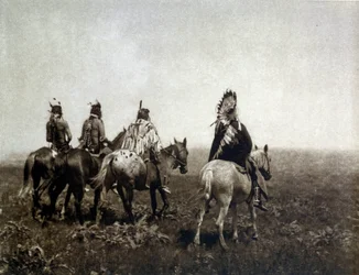 Guerreiro indiano (O Apsaroke) cavalgando na planície