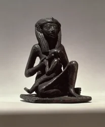 Princesa cuidando de uma criança, possivelmente de Edfu, Segundo Período Intermediário (cobre)