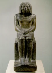 Figura masculina sentada, Egito, Ankh, 3ª dinastia (granito porfiróide)