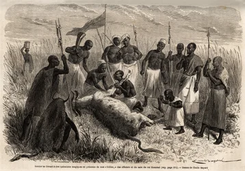 Um feiticeiro se envolve em operações mágicas sobre uma carne abatida em Uganda, desenhadas por Emile Bayard (1837-1891), ilustrando a viagem de descoberta do Capitão Speke na África de 1860 a 1863. Gravura em "Le tour du monde", editado por Edouard Charto
