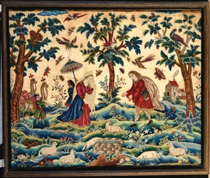 Uma bela imagem de bordado bordada em lãs e sedas, provavelmente representando a reunião de Jacob e Rachel no Poço
