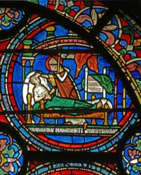 Detalhe da janela do milagre que descreve St. Thomas visitando um homem doente em seu sono
