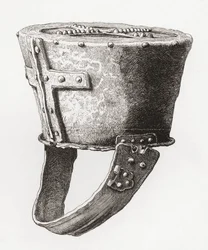 Capacete, do Castelo Pomeroy, Inglaterra, datado do século XII, do Exército Britânico: As suas Origens, Progresso e Equipamento, publicado em 1868.
