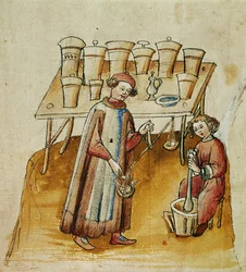 Um farmacêutico e o seu assistente trituram ervas e raízes para uso medicinal, c.1380-1400