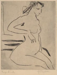 Nu feminino sentado