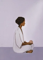 Mulher a meditar com uma flor de lótus