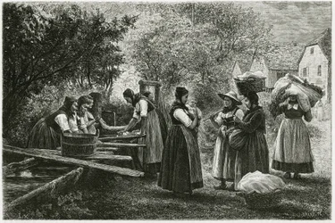 Uma lavandaria em Metzeral, mulheres com trajes tradicionais de vallee reúnem-se na fonte da aldeia. Gravura de E.Ronjat, para ilustrar a história "Atravers l