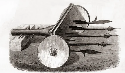 Uma Ribauldequina, máquina infernal ou arma de órgãos, armada com pequenos canhões e piques, de Les Merveilles de la Science, publicada c.1870 (gravura)
