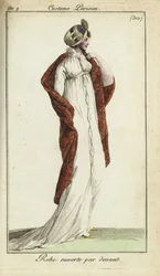 Mulher da moda com chapéu de palha, vestido e xaile