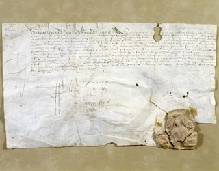 Carta assinada por Henri IV, instituindo Dinan como presidente depois de a cidade lhe ter sido devolvida