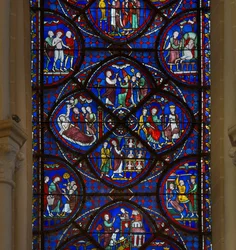 Vidro manchado da catedral de Chartres: detalhe da vida de São Tomás de Aquino
