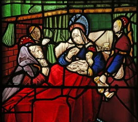 Janela w17 representando a vida de St Remi. o santo eremita Montan é miraculosamente curado pelo leite aplicado pelo santo aos seus olhos