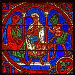 Janela w1 representando uma cena da história de Theophilus: ele é apresentado a Satanás por um mágico