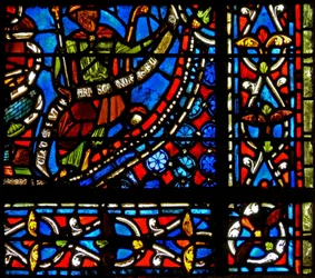 Janela w9 representando o faraó segurando uma bandeirola com as palavras que I Clemente de Chartres fez esta janela (na janela de Joseph)