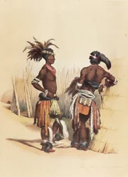 Dois jovens zulus, adornados com trajes tradicionais vibrantes