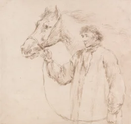 O homem que segura o cavalo junto à cabeçada