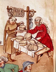 Comércio: um vendedor de pão. Miniatura da «Crónica do Concílio de Constança» de Ulrich Richental (1360-1437), cerca de 1438. Praga, Biblioteca Nacional