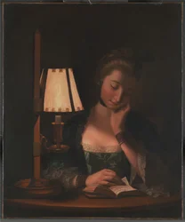 Mulher a ler à sombra de uma campainha de papel