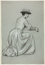 Mulher ajoelhada com chapéu de palha