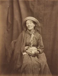 Mulher segurando um pássaro morto, Asilo do Condado de Surrey, c. 1855 (foto)
