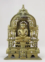 Imagem sentada do Jain Tirthankara Kuntanatha, Vasantagarh, sul do Rajastão, 1476 (latão com incrustações de cobre e prata)