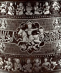 Arte islâmica: Candelabro de prata e cobre do século XIII. Um cavaleiro com um arco é representado no objecto. Cairo, Museu de Arte Islâmica