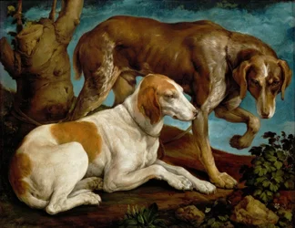 Dois cães de caça, amarrados ao tronco de uma árvore