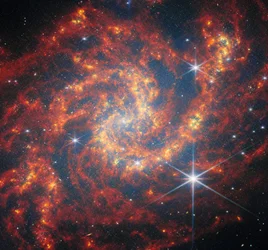 Webb visita uma espiral de formação de estrelas