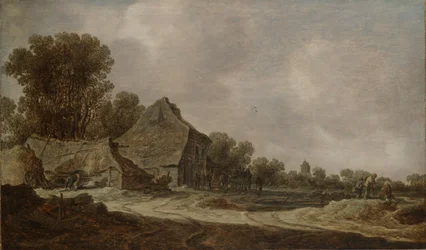 Uma estrada arenosa com casas de colmo