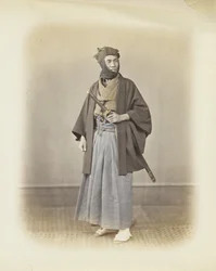 Homem japonês em vestido tradicional (foto a p/b colorida à mão)