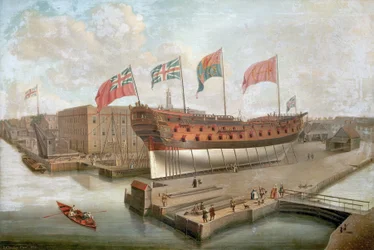 O HMS "Buckingham" nas docas em frente ao armazém principal dos Estaleiros Reais em Deptford (Inglaterra)
