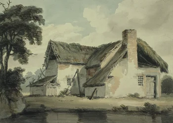 Casa de colmo perto de uma lagoa