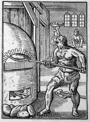 Um padeiro a cozer pão no forno. Gravura de Jost Amman (1539-1591) Século XVI.